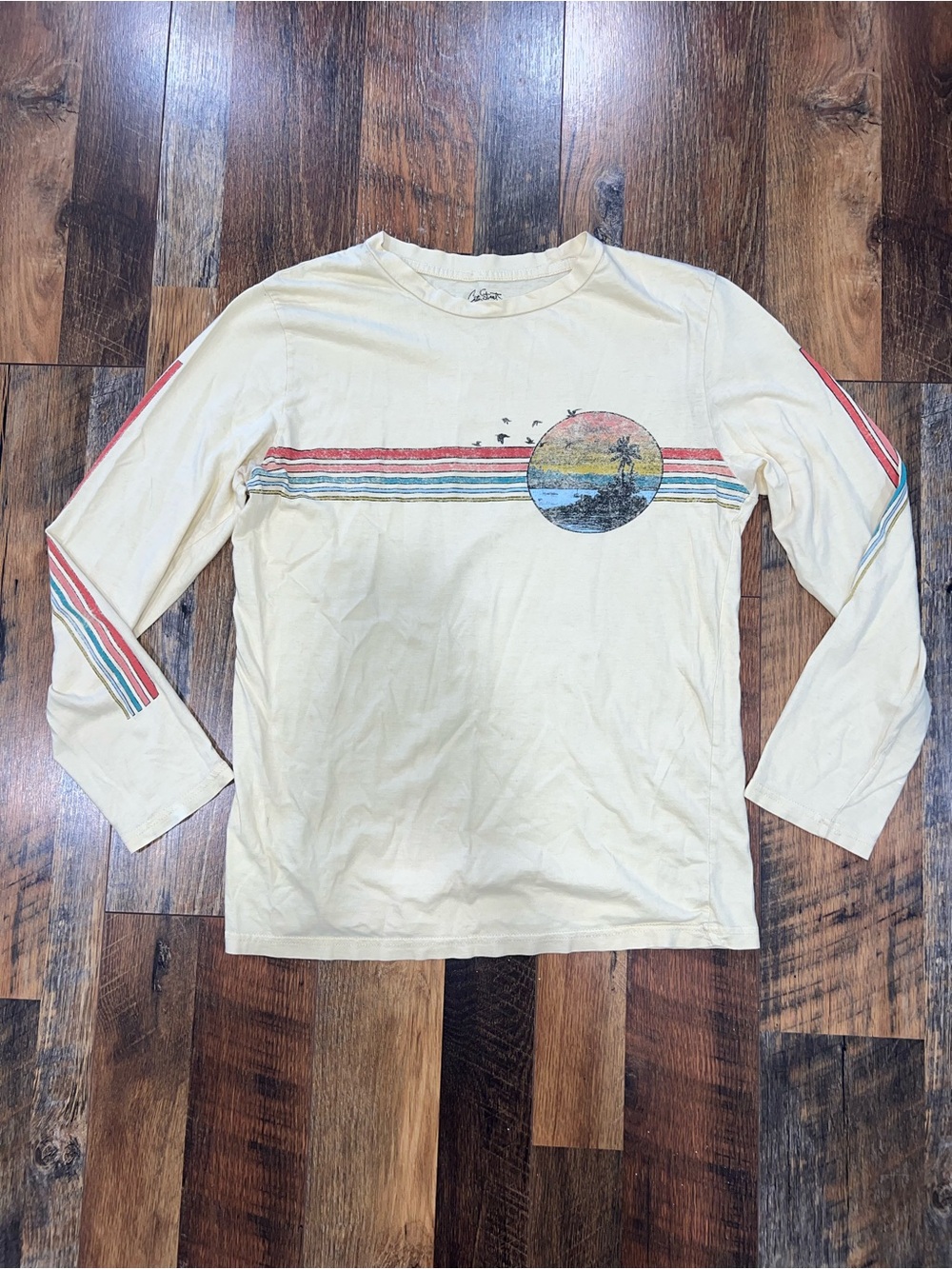 City Streets Cream Long Sleeve Tee with Retro Stripes and Sunset Graphic
